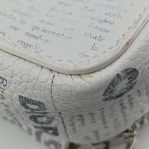 Secondhand Christian Dior Daniel Arsham collaboration Newspaper Print White Leather shoulderbag | stylenewstar