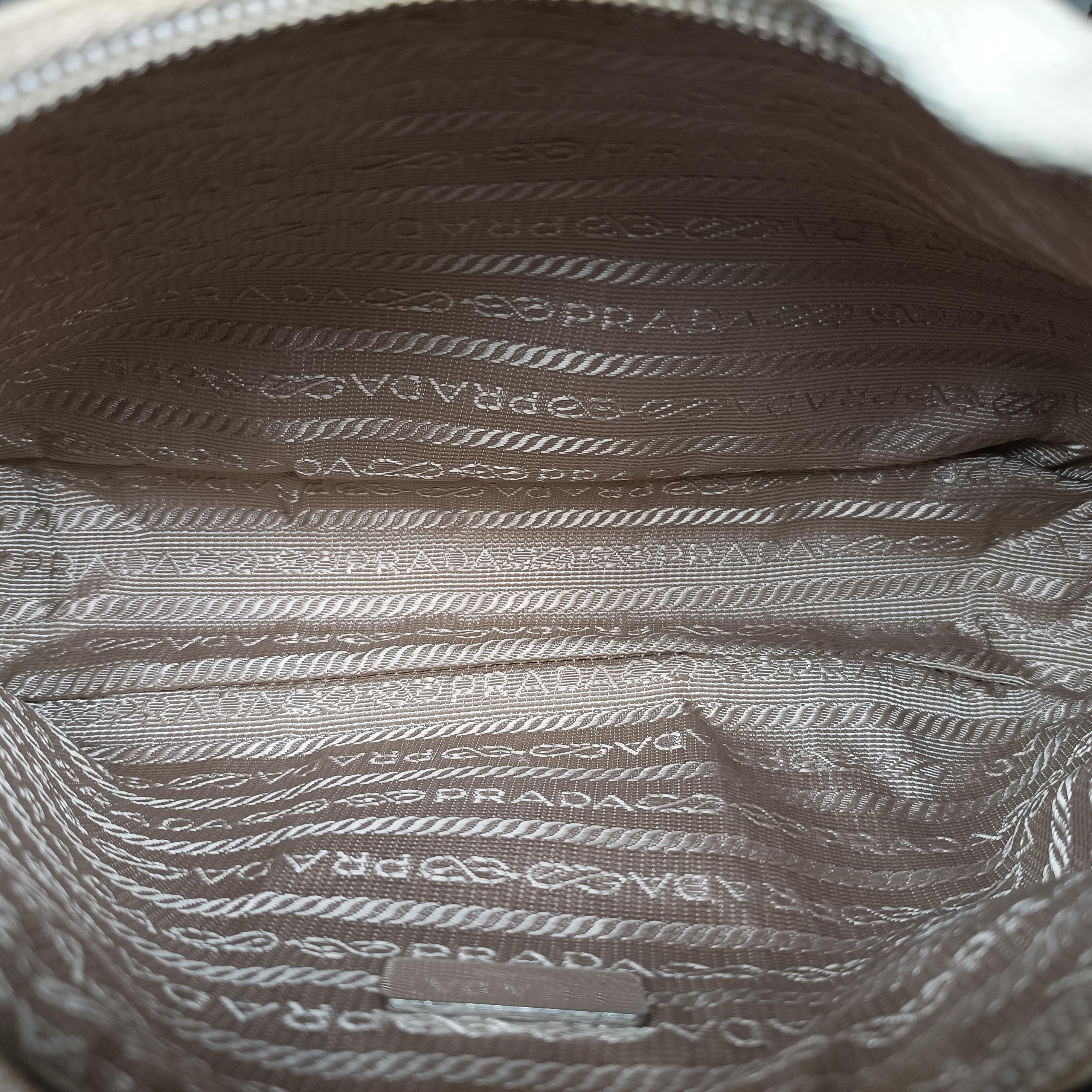 Pre-owned Prada Re-Edition 2005 Re-Nylon Bag Beige nylon 1BH204 handbag | stylenewstar