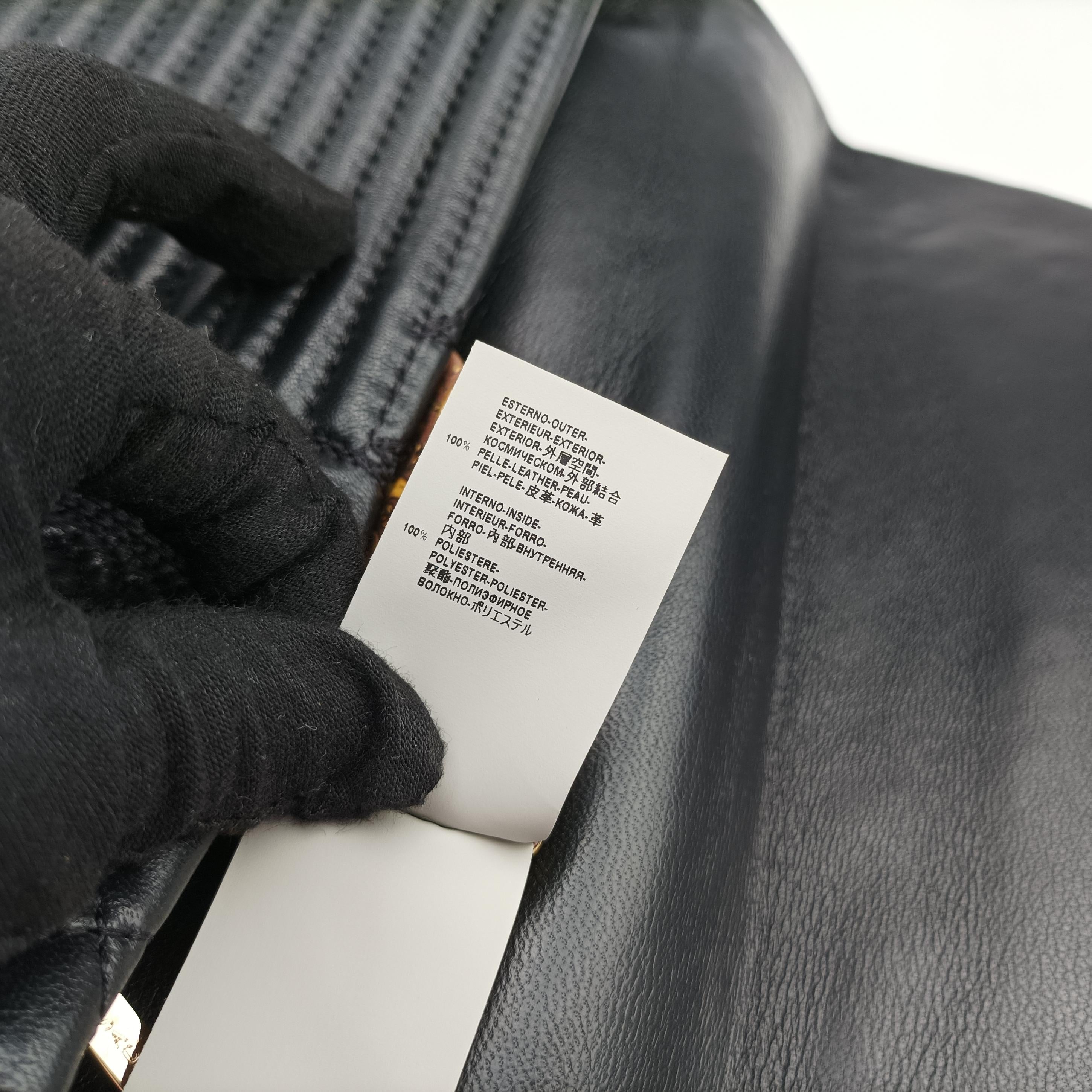 Vintage VERSACE Embossed Leather Talia Vanitas Black Leather  handbag | stylenewstar