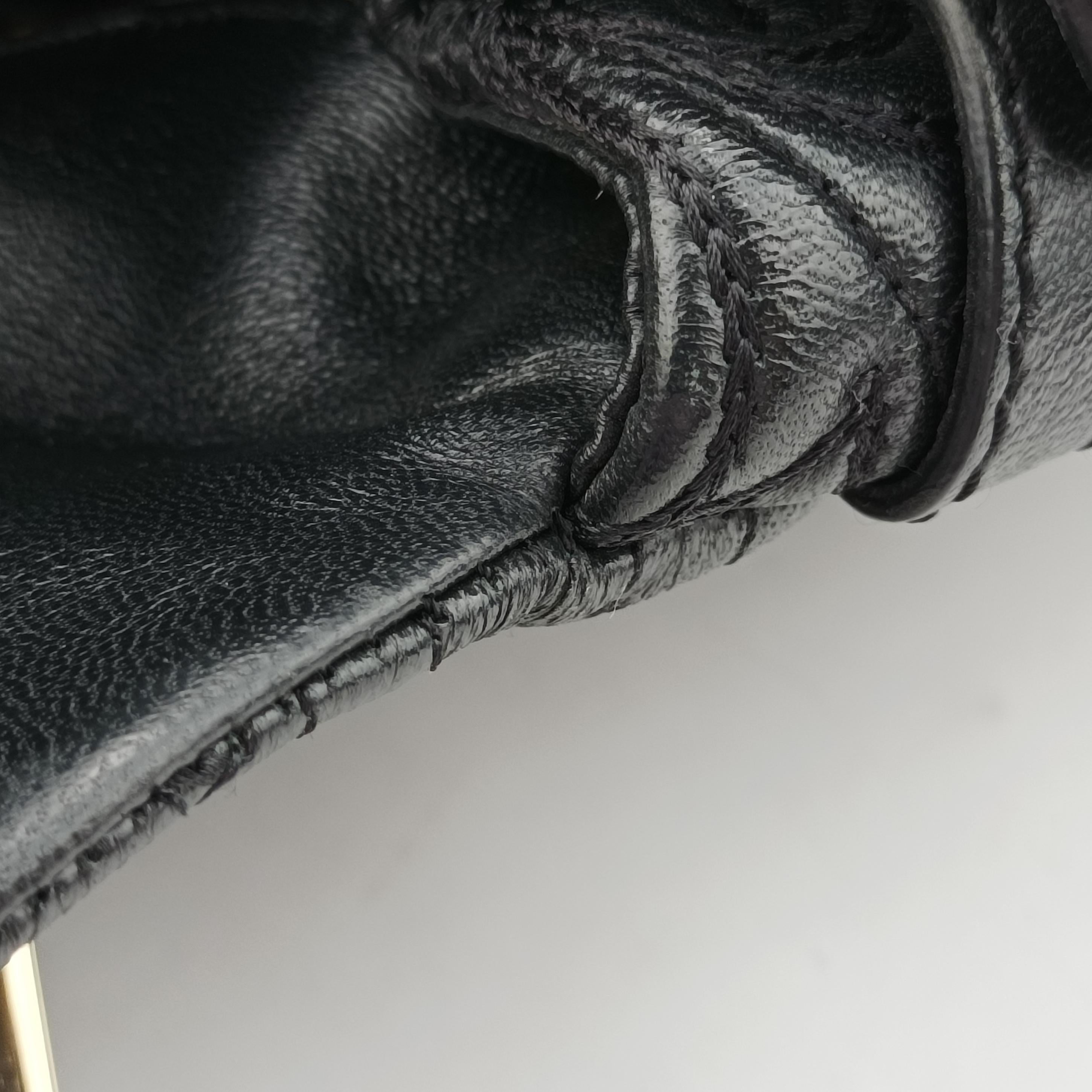 Vintage VERSACE Embossed Leather Talia Vanitas Black Leather  handbag | stylenewstar