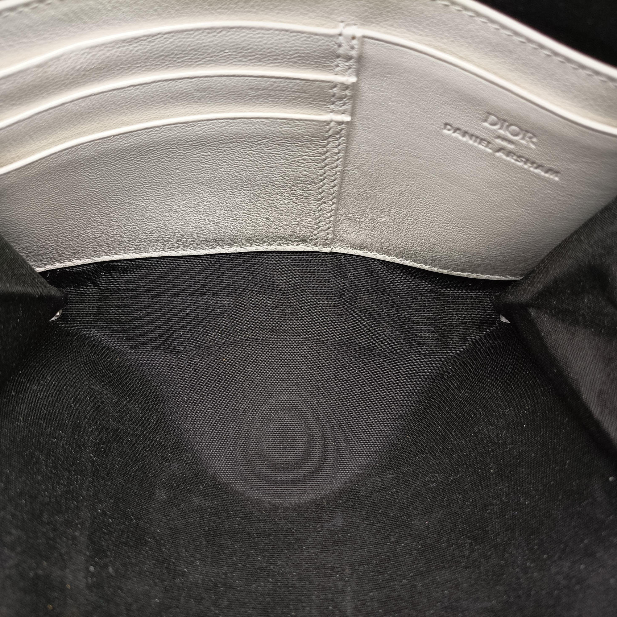 Secondhand Christian Dior Daniel Arsham collaboration Newspaper Print White Leather  shoulderbag | stylenewstar