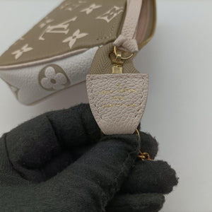 Pre-owned Louis Vuitton Mini Pochette Accessoires Khaki × Beige Monogram Empreinte M81284 handbag | stylenewstar