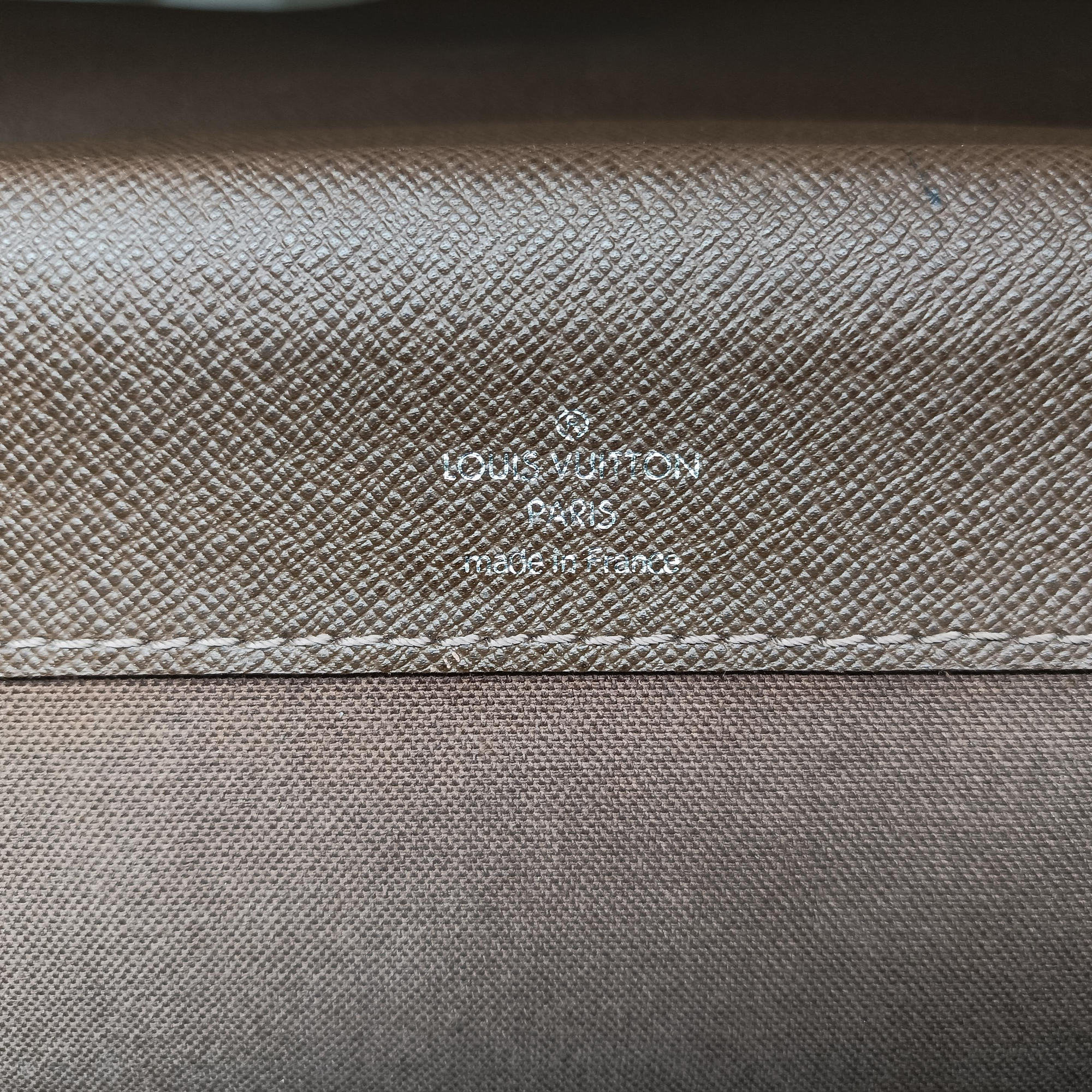 Pre-owned Louis Vuitton Serviette Moskova Grizzly Taiga M31058 handbag | stylenewstar
