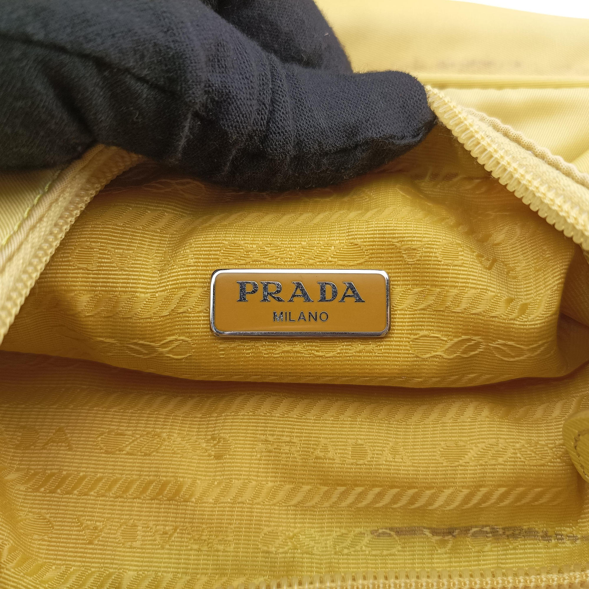 Secondhand Prada Re-Edition2000 Yellow nylon 1NE515 handbag | stylenewstar